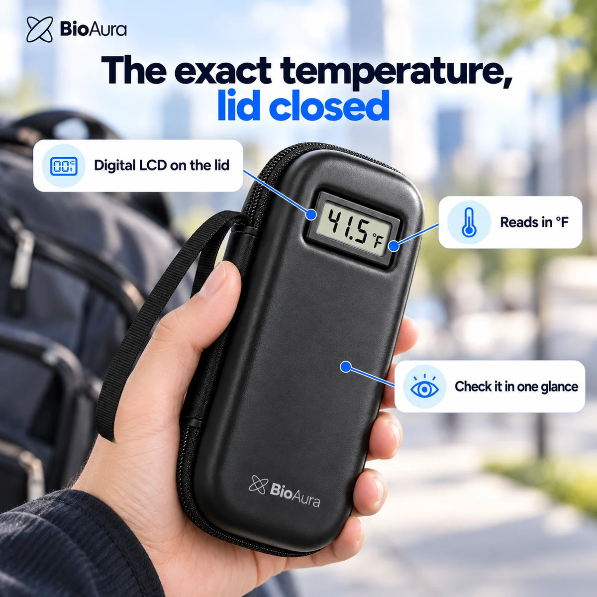 Hand holding the closed BioAura Case, digital LCD on the lid reading 41.5 °F